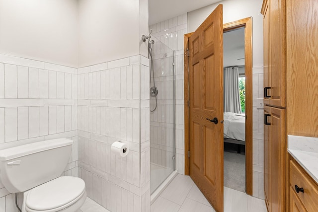 2554 160th Ave NE, Ham Lake, MN 55304 - full bath featuring vanity, a shower stall, toilet, ensuite bath, and tile patterned flooring