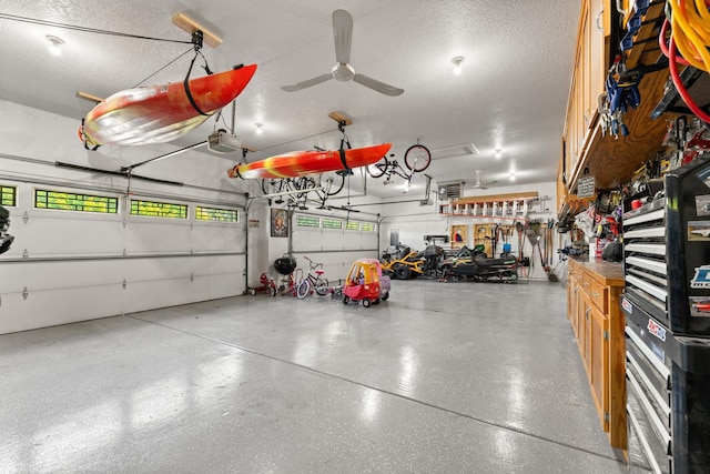 2554 160th Ave NE, Ham Lake, MN 55304 - garage with a garage door opener and a ceiling fan