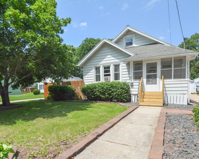 1331 1st St SE, Rochester, MN 55904 - bungalow featuring a shingled roof, a sunroom, and entry steps