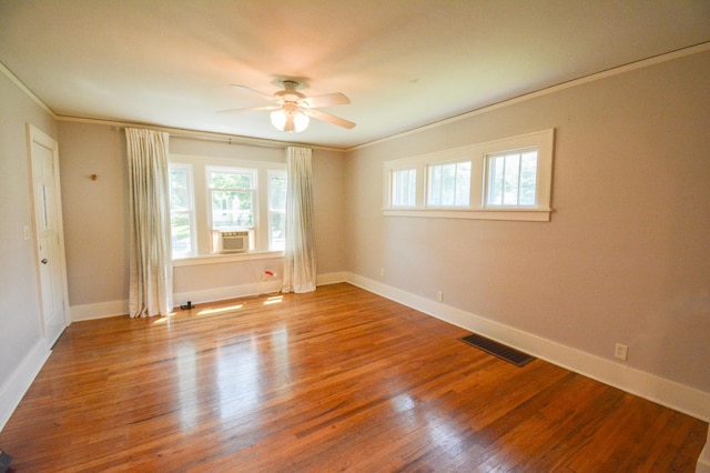 1331 1st St SE, Rochester, MN 55904 - empty room featuring ceiling fan, ornamental molding, healthy amount of natural light, wood finished floors, and baseboards