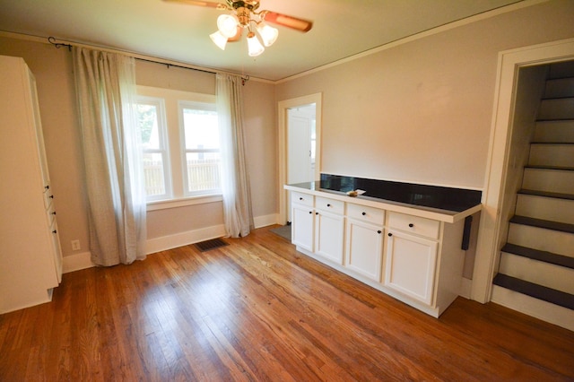 1331 1st St SE, Rochester, MN 55904 - interior space with ceiling fan, light wood-style floors, baseboards, and ornamental molding