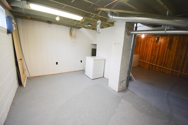 1331 1st St SE, Rochester, MN 55904 - unfinished basement with refrigerator and concrete block wall