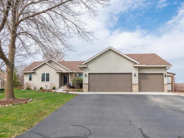 16850 Willowwood Cir SE, Prior Lake, MN 55372 - single story home with a garage, driveway, a front yard, brick siding, and a shingled roof