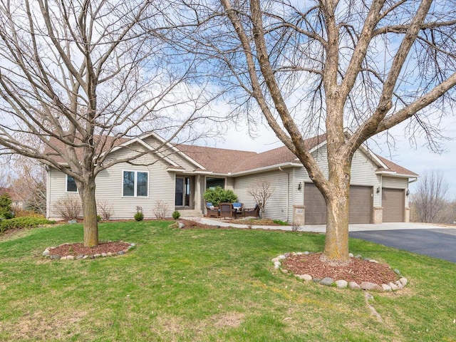 16850 Willowwood Cir SE, Prior Lake, MN 55372 - single story home featuring a front yard, an attached garage, driveway, brick siding, and a shingled roof