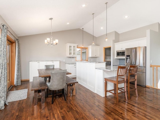 16850 Willowwood Cir SE, Prior Lake, MN 55372 - dining space featuring dark wood-type flooring, a chandelier, high vaulted ceiling, and recessed lighting