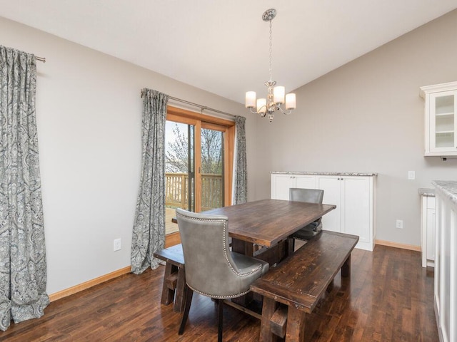 16850 Willowwood Cir SE, Prior Lake, MN 55372 - dining space with a chandelier, dark wood finished floors, vaulted ceiling, and baseboards