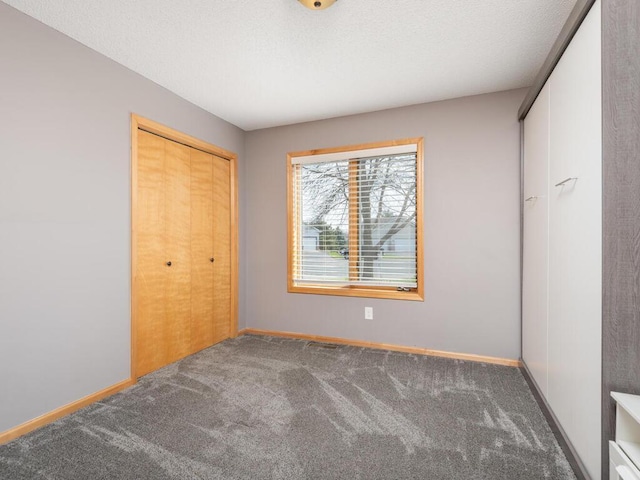 16850 Willowwood Cir SE, Prior Lake, MN 55372 - unfurnished bedroom with carpet floors, a closet, and baseboards