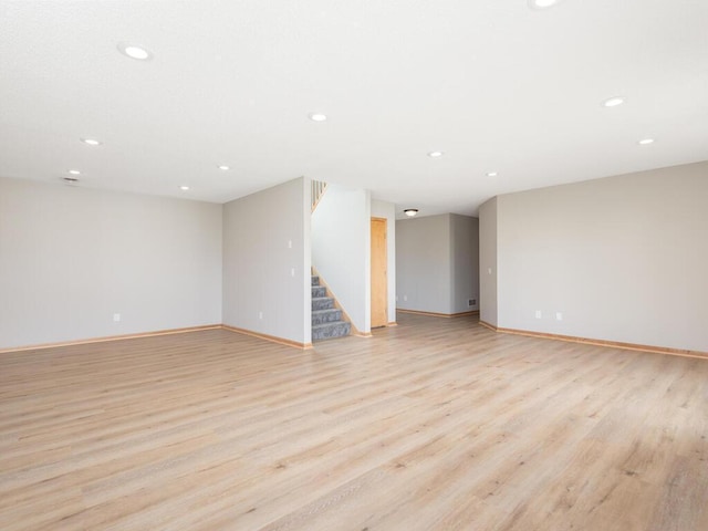 16850 Willowwood Cir SE, Prior Lake, MN 55372 - unfurnished room with recessed lighting, stairs, light wood-style flooring, and baseboards