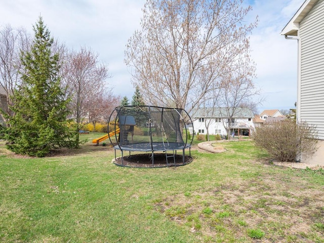 16850 Willowwood Cir SE, Prior Lake, MN 55372 - view of grassy yard featuring a trampoline and a playground