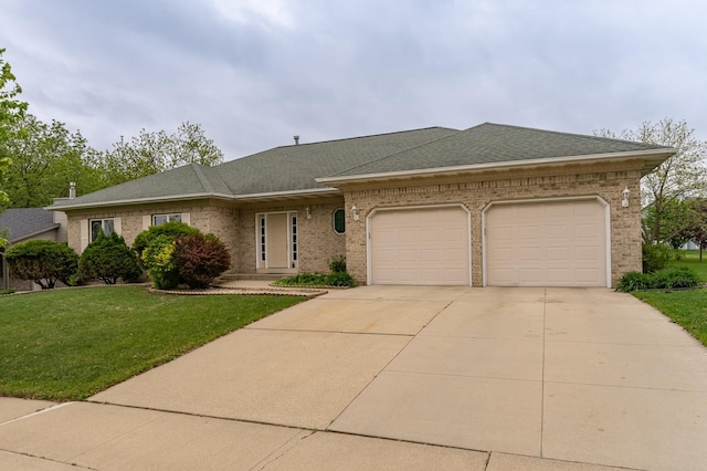 2310 Wilshire Ln NE, Rochester, MN 55906 - view of front of home featuring a garage, driveway, brick siding, and a front yard