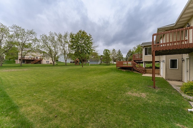 2310 Wilshire Ln NE, Rochester, MN 55906 - view of green lawn with a deck and stairs