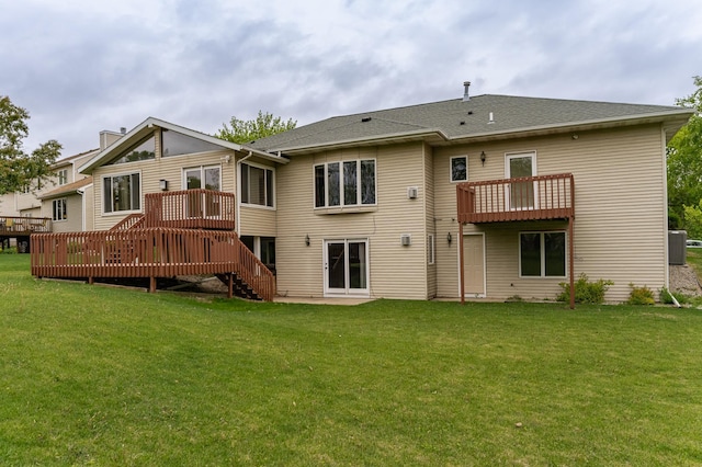 2310 Wilshire Ln NE, Rochester, MN 55906 - back of property featuring a deck, a yard, stairway, and cooling unit