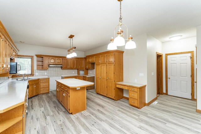 2310 Wilshire Ln NE, Rochester, MN 55906 - kitchen with open shelves, a center island, light wood-style floors, backsplash, and brown cabinetry
