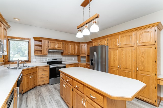 2310 Wilshire Ln NE, Rochester, MN 55906 - kitchen featuring stainless steel appliances, a sink, light wood-type flooring, light countertops, and under cabinet range hood