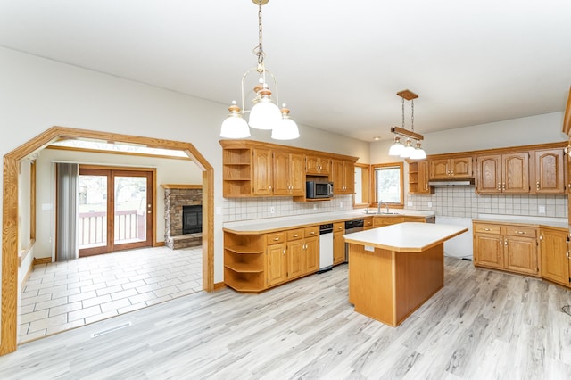 2310 Wilshire Ln NE, Rochester, MN 55906 - kitchen with open shelves, a sink, stainless steel microwave, a kitchen island, and light countertops