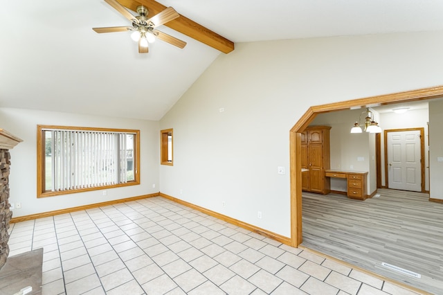 2310 Wilshire Ln NE, Rochester, MN 55906 - unfurnished living room with beam ceiling, baseboards, ceiling fan, arched walkways, and a chandelier
