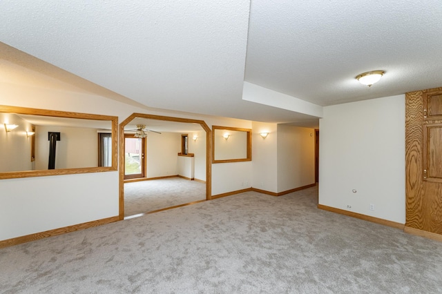 2310 Wilshire Ln NE, Rochester, MN 55906 - below grade area with carpet flooring, a textured ceiling, and baseboards