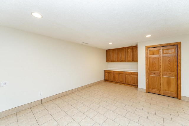 2310 Wilshire Ln NE, Rochester, MN 55906 - bar featuring recessed lighting, baseboards, and a textured ceiling