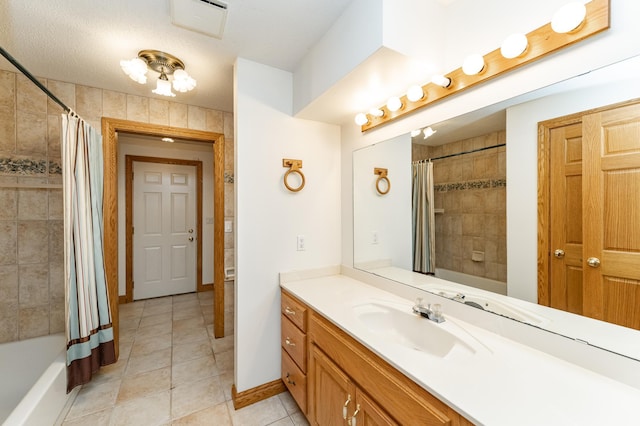2310 Wilshire Ln NE, Rochester, MN 55906 - full bath with vanity, tile patterned flooring, shower / bath combo with shower curtain, and baseboards