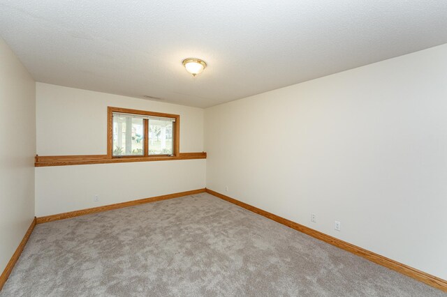 2310 Wilshire Ln NE, Rochester, MN 55906 - carpeted spare room featuring baseboards