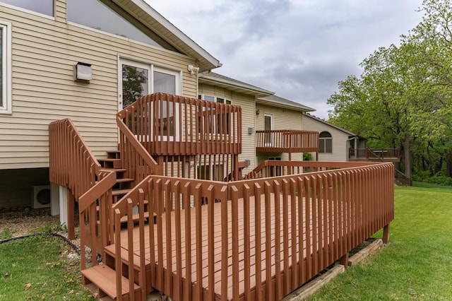 2310 Wilshire Ln NE, Rochester, MN 55906 - wooden deck featuring stairway, a lawn, and a cooling unit