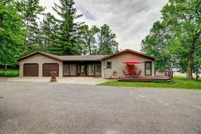 14070 County 18, Park Rapids, MN 56470 - ranch-style home featuring a garage, a deck, and concrete driveway