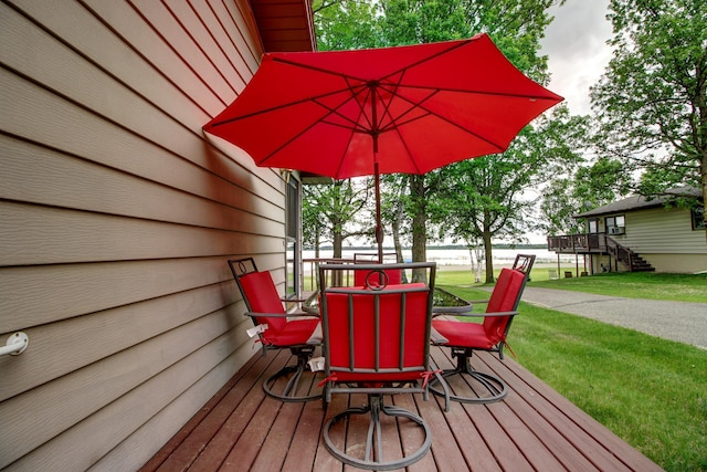 14070 County 18, Park Rapids, MN 56470 - wooden terrace featuring a yard and outdoor dining area
