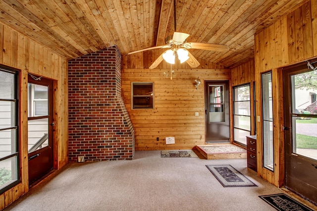 14070 County 18, Park Rapids, MN 56470 - entrance foyer featuring lofted ceiling, wooden walls, healthy amount of natural light, wood ceiling, and carpet floors