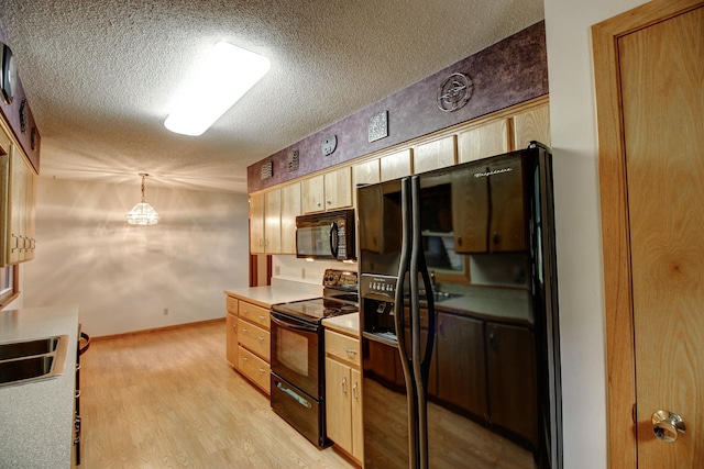 14070 County 18, Park Rapids, MN 56470 - kitchen featuring black appliances, a textured ceiling, light wood-type flooring, a sink, and light countertops