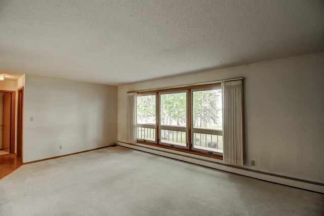 14070 County 18, Park Rapids, MN 56470 - empty room featuring a baseboard heating unit, carpet, a textured ceiling, and baseboards