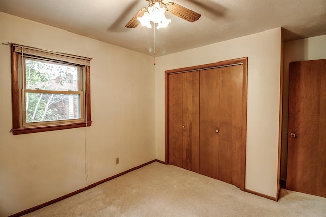 14070 County 18, Park Rapids, MN 56470 - unfurnished bedroom featuring carpet, a closet, baseboards, and ceiling fan