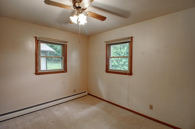 14070 County 18, Park Rapids, MN 56470 - empty room featuring a baseboard radiator, healthy amount of natural light, light colored carpet, and baseboards