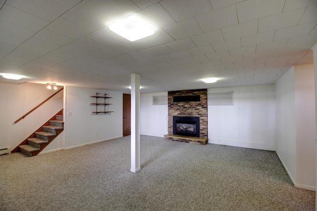 14070 County 18, Park Rapids, MN 56470 - finished basement featuring carpet, a fireplace, stairway, baseboards, and a baseboard radiator