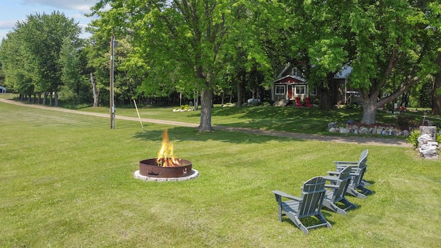 35301 Lily St NW, Springvale Twp, MN 55008 - view of property's community with an outdoor fire pit and a yard
