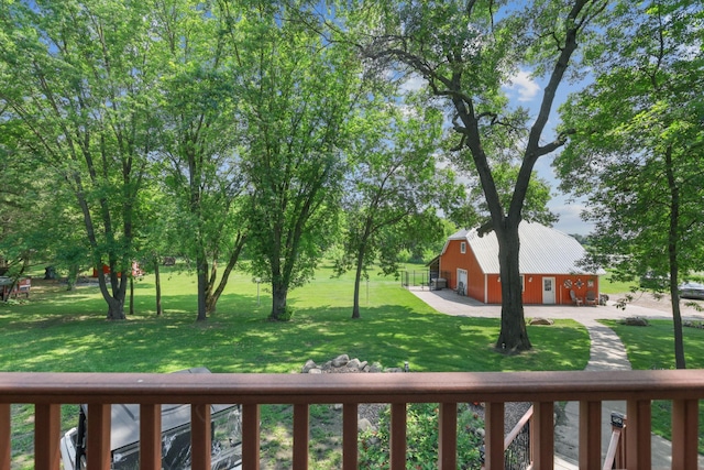 35301 Lily St NW, Springvale Twp, MN 55008 - view of grassy yard with a detached garage, an outbuilding, and a barn