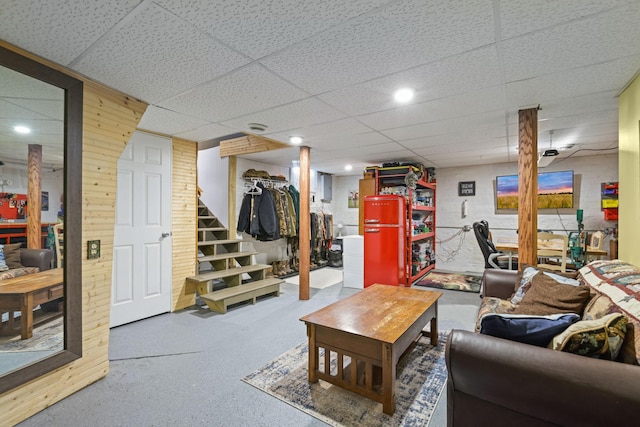 35301 Lily St NW, Springvale Twp, MN 55008 - living room with a paneled ceiling, carpet floors, wooden walls, and stairway