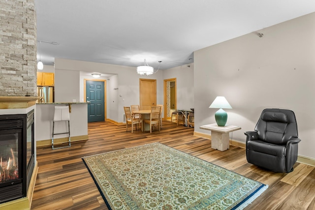 620 Main St N Unit 412, Stillwater, MN 55082 - living area with a stone fireplace and dark wood-style floors