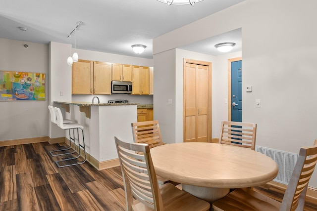 620 Main St N Unit 412, Stillwater, MN 55082 - dining space featuring dark wood-style flooring and track lighting