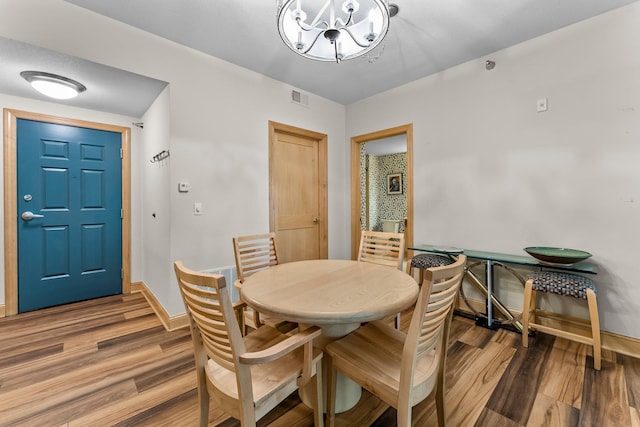 620 Main St N Unit 412, Stillwater, MN 55082 - dining space featuring a chandelier and wood finished floors