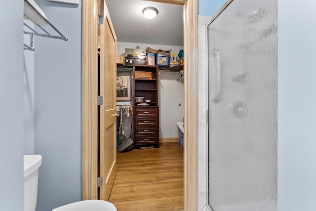 620 Main St N Unit 412, Stillwater, MN 55082 - full bathroom featuring wood finished floors and a stall shower
