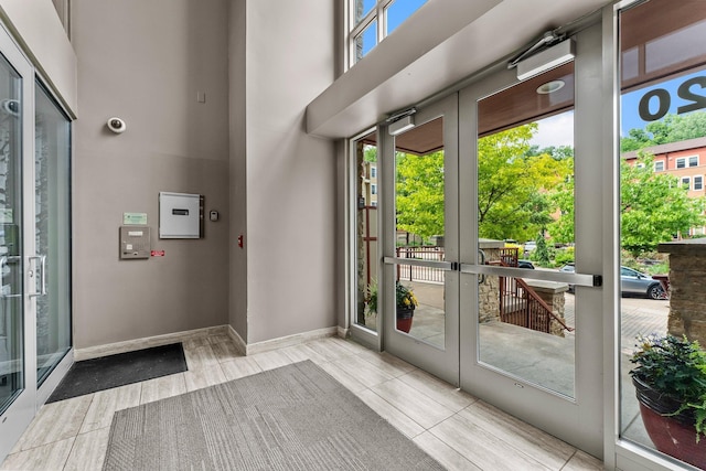 620 Main St N Unit 412, Stillwater, MN 55082 - doorway featuring french doors, a high ceiling, and tile patterned flooring