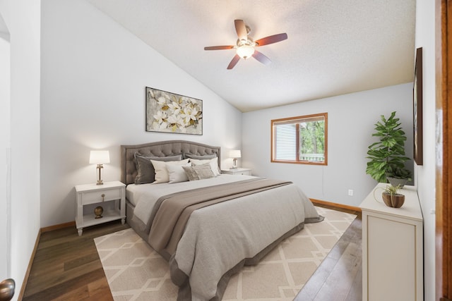 7813 111th St, Bloomington, MN 55438 - bedroom with wood finished floors, a textured ceiling, vaulted ceiling, and ceiling fan