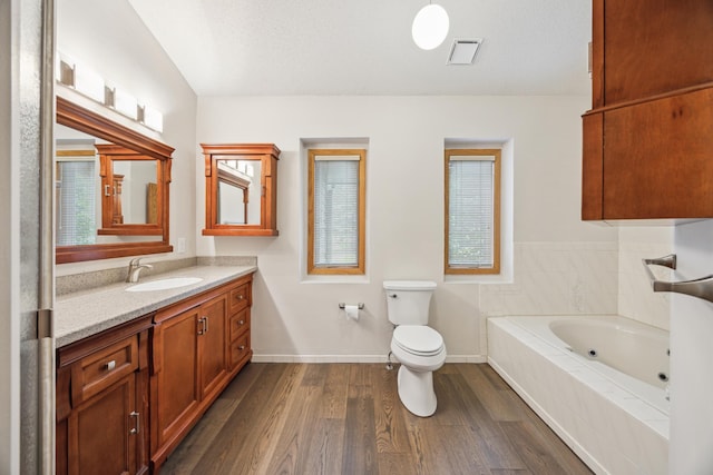 7813 111th St, Bloomington, MN 55438 - full bath with vanity, a whirlpool tub, and wood finished floors