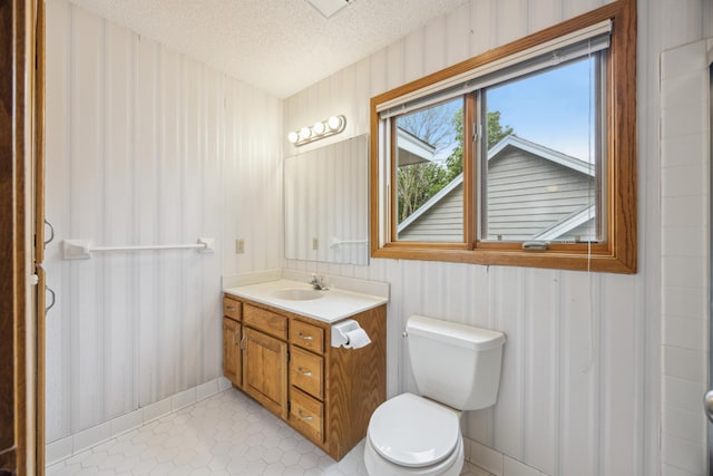 7813 111th St, Bloomington, MN 55438 - bathroom with vanity, a textured ceiling, and tile patterned flooring