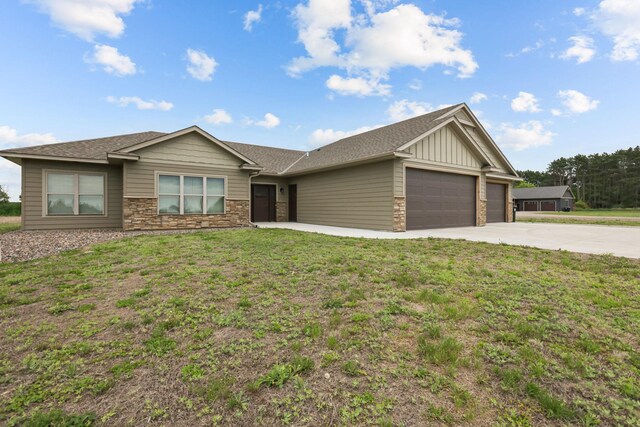5855 281st Ave NW, Spencer Brook Twp, MN 55040 - ranch-style house featuring a garage, stone siding, driveway, a front lawn, and board and batten siding