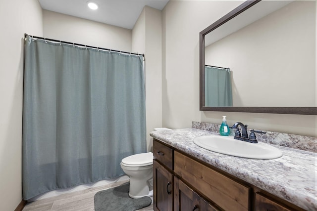 5855 281st Ave NW, Spencer Brook Twp, MN 55040 - full bath with vanity, toilet, and a shower with shower curtain