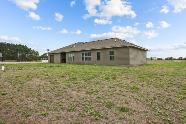5855 281st Ave NW, Spencer Brook Twp, MN 55040 - rear view of house featuring a lawn