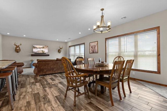 5855 281st Ave NW, Spencer Brook Twp, MN 55040 - dining space with wood finished floors, a chandelier, and recessed lighting
