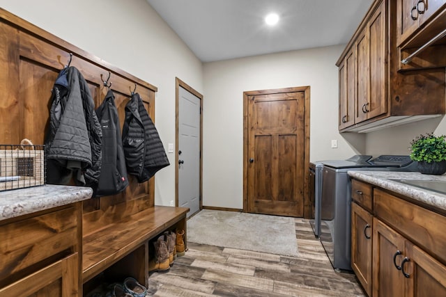 5855 281st Ave NW, Spencer Brook Twp, MN 55040 - washroom featuring washer and dryer, wood finished floors, cabinet space, and recessed lighting