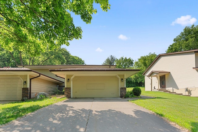 4427 Chatsworth St N, Shoreview, MN 55126 - view of front of house featuring brick siding, a garage, and a front yard